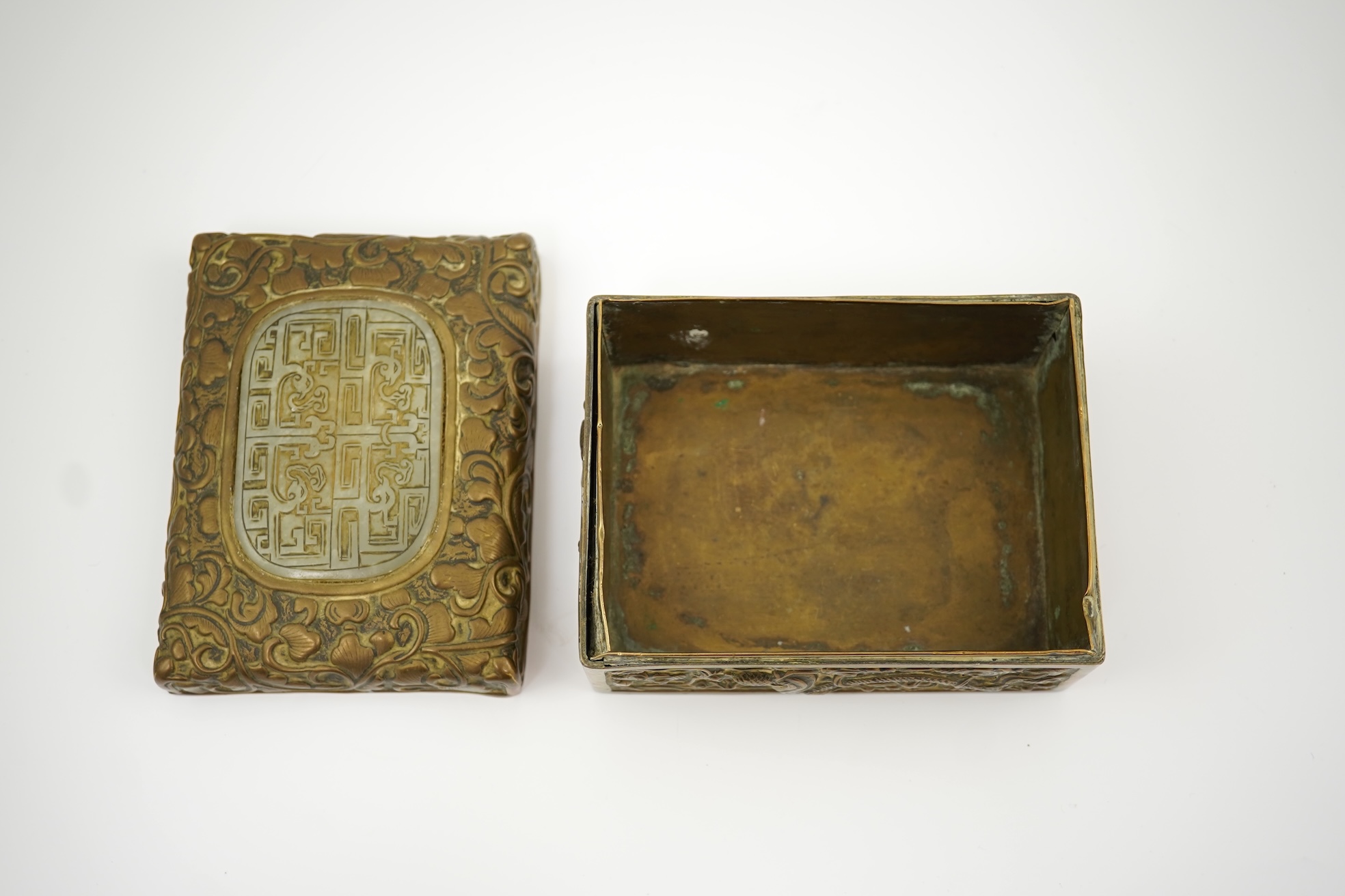 A Chinese brass 'dragon' box, inset with a 17th/18th century jade plaque
